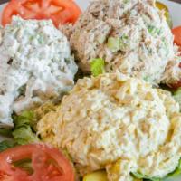 Salad Plate · Chicken, tuna, or egg salad served on a bed of greens with tomatoes, pickles and cucumber.