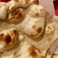 Plain Naan · Leavened white bread baked in the clay oven.