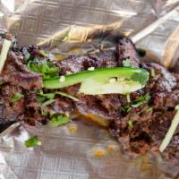 Bihari Kabab · A tenderized skirt-cut strip of beef marinated in traditional spices and grilled.