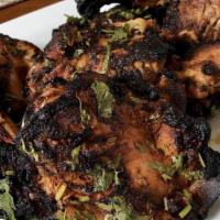 Chicken Tikka · Char-grilled chicken leg marinated in tandoori spices.