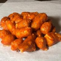 Buffalo Bites · Delicious basket of fried cheddar cheese curds tossed in buffalo sauce and served with chipo...