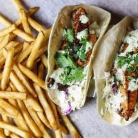 Blackened Fish Tacos · Blackened catfish, fresh cole slaw and a drizzle of house made cilantro lime crema