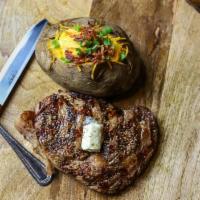 Cold Smoked Ribeye · Cold smoked ribeye loin hand cut fresh to 12 ounces. Served with Baked Potato or two sides.