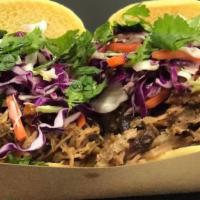 Pulled Pork Sliders (2) · Martin’s potato rolls topped with pulled pork, chipotle citrus bbq sauce, pickled slaw, fres...
