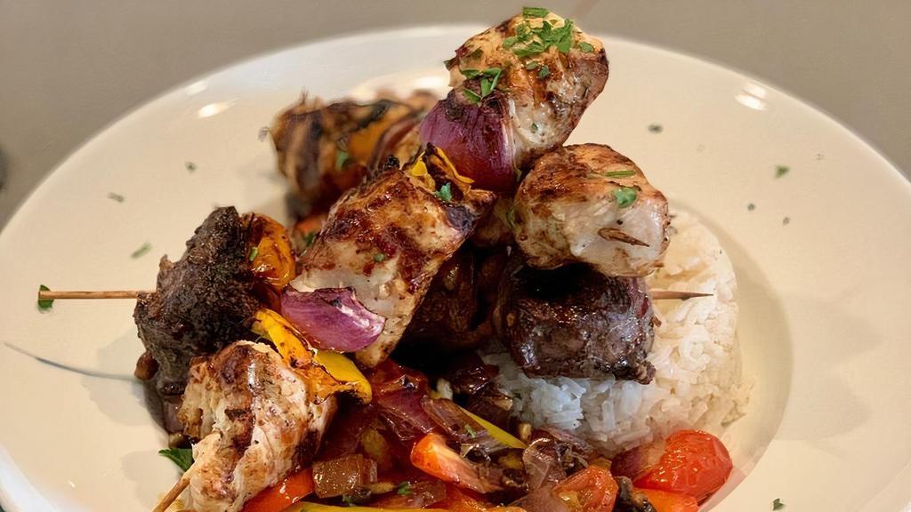 Skewers · Chicken or beef. skewers grilled with green peppers, onions and mushrooms served over rice.