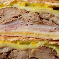 Cuban · Grilled turkey and ham, melted provolone, pickles and deli mustard.