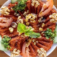 Muhammara · Vegetarian. A mix of red pepper paste, walnuts, bulgur, pomegranate sauce, topped with mozza...