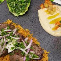 Beef Kabob Platter · Grilled, marinated pieces of lean beef over a bed of rice.