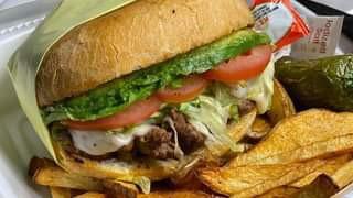 Sdt Burger · Hamburger patty, ham, steak, white cheese, lettuce, tomato, avocado and fries on the side.