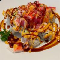 Rock'N Roll · California Roll topped with Fresh Tuna, Fresh Salmon, Crabstick mixed with (Eel Sauce, Spicy...