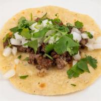 Impossible Taco (Vegan) · impossible vegan meat substitute, cilantro, onion, corn tortilla