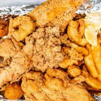 Fried Catfish, Shrimp, And Lobster · 2 pc fried catfish, 10 fried shrimp, and a fried lobster, hush puppies, and fries