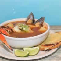 Caldo De Mariscos · Seafood medley soup. Includes: Fish, shrimp, crab, mussels and octopus. Served with a side o...