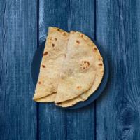 Wheat Chapati  · A light whole wheat flat bread baked to perfection over a pan.