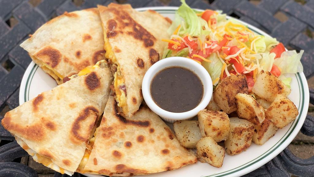Breakfast Quesadilla · Eggs and cheese With your choice of sausage, Bacon, chorizo, turkey or ham. Served With small salad and roasted potatoes.