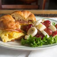 Breakfast Croissant Sandwich · Eggs and cheese With ham or turkey, With fresh fruit or potatoes.