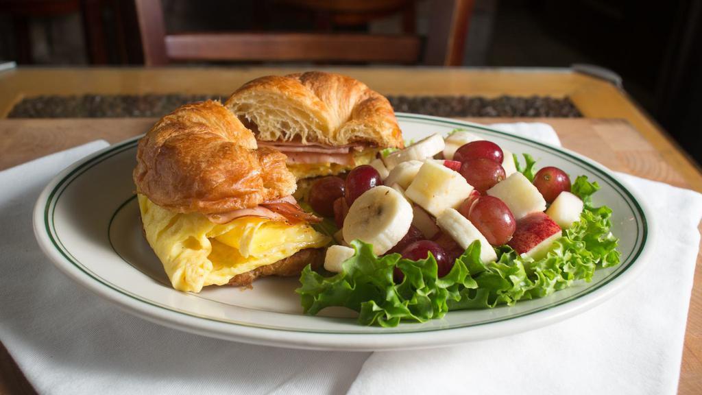 Breakfast Croissant Sandwich · Eggs and cheese With ham or turkey, With fresh fruit or potatoes.