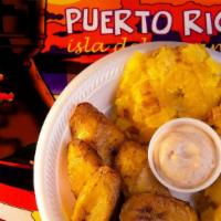 Tostones · Sliced green plantains twice fried.