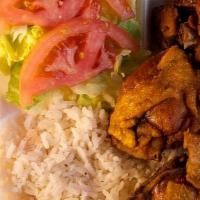 Chicharron De Pollo, Arroz, Habichuelas Plate · Fried chicken with white rice, beans and salad.