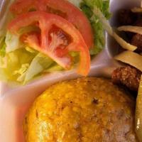Tri Fongo Con Carne · Mashed fried green, yellow-plantain and yucca with fried pork and salad.