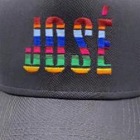 José Sarape Trucker Hat · Adjustable snapback trucker hat with cotton front & mesh panels.. Color: Dark Gray w/ Multi ...