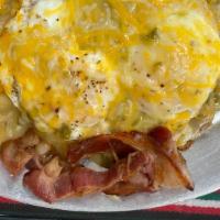Breakfast Skillet · Breakfast skillet loaded with potatoes with green or red chile, 2 eggs to order, cheese, bac...