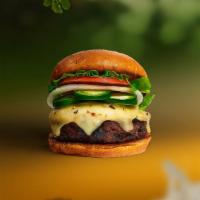 Laps For Jalapeño Burger · Seasoned Beyond meat patty topped with melted vegan cheese, jalapenos, lettuce, tomato, onio...