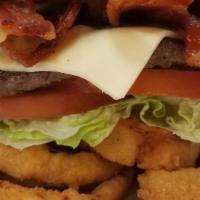 Western Deluxe Burger  · Served with BBQ, fried onion rings, Lettuce, tomato, pickles, Hamburger Patty, swiss cheese ...