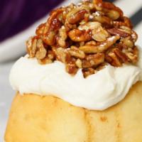 Texas Pecan Praline  · cream cheese frosting topped with homemade pecan praline, caramel sauce and powdered sugar