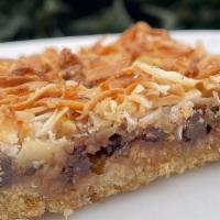 Magic Cookie Bars* · a rich layered cookie bar with graham cracker crust, plant based sweetened condensed soy mil...