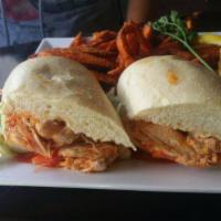 Buffalo Chicken Sand · Battered tenders tossed in buffalo sauce then topped with melted pepper jack cheese, spring ...