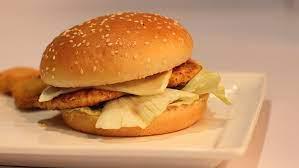 Chicken Classic Burger · Breaded chicken , lettuce , tomatoes , pickles , mayo , ketchup and mustard.