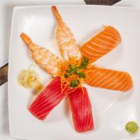 Nigiri Sushi (2 Pieces) · Choice of salmon, tuna, yellowtail shrimp masago unagi (EEL) or seared tuna (2pcs).