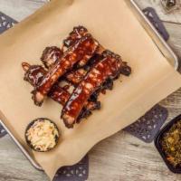 Island Vibe Bbq Ribs 1/2 Rack · Slow-cooked St. Louis ribs grilled to perfection, dry rubbed with brown sugar and spices, wi...