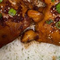 Ginger Garlic Braised Chicken · Leg Quarter cooked in a Ginger Garlic Sauce. Garnished with Green Onions and Sesame Seeds. S...
