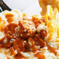 Buffalo Chicken Mac · white cheddar, mozzarella, and blue cheese, topped with fried chicken bites tossed in buffal...