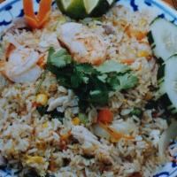 Thai Fried Rice · Fried rice with egg, carrot, onion, pea, cucumber, and cilantro.