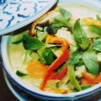 Green Curry · Green curry, coconut milk, carrot, bell pepper, bamboo shoot, zucchini, green bean, and basil.