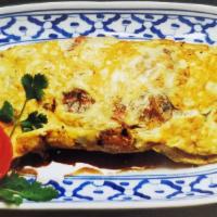 En24. Thai Omelette · Ground pork, carrot, bell pepper, onion, cabbages, tomato, bean sprout, potato, and covered ...