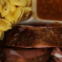 2 Meat Plates · Your choice of two meats and two sides with bread and sauce $18