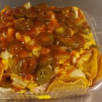Nachos · A healthy portion of our signature nachos with either pulled pork, brisket, or a combination...