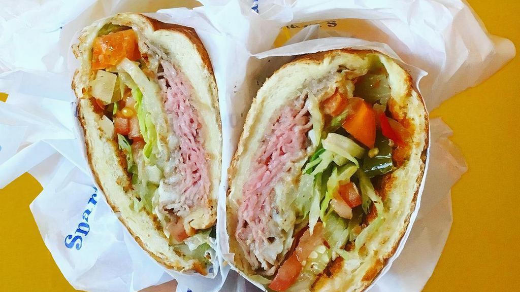 Prime Rib & Provolone Cheese · Served with ALL TOPPINGS: . Mayo, Mustard, Hot Peppers, Onion, Lettuce, Tomato, Pickle, Seasoning & Oil