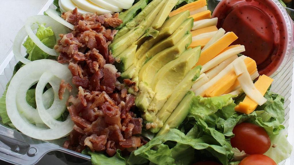 Cobb Salad · Served with Avocado, American & Provolone Cheese, w/ Grape Tomatoes, Hard-Boiled Egg, Onion and Bacon Bits on a bed of Lettuce
