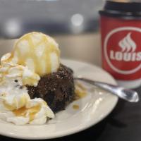 Lava Island Cake · Chocolate cake filled with dark chocolate truffles, topped with vanilla ice cream