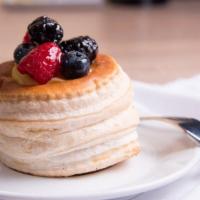 Vanilla Puff · Baked puff Pastry filled with pleasant vanilla crème topped with fresh raspberry / blueberry...