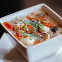 Tom Kha Soup · Thai coconut milk soup with mushrooms, infused with kaffir lime leaves, galanga & lemongrass...