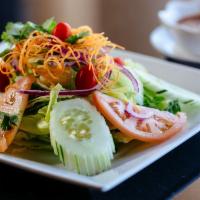 House Salad · Fresh green vegetables with homemade peanut dressing.