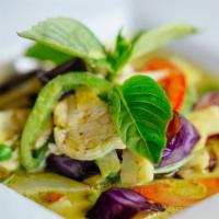Green Curry · Green curry paste in coconut milk with bell peppers, eggplant, bamboo shoots, sweet peas & f...
