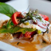 Panang Curry · Red curry paste mixed with kaffir lime leaves cooked with coconut milk, sweet peas, bell pep...