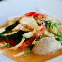Gang Dang (Red Curry) · Red curry paste in coconut milk with bell peppers, zucchini, bamboo shoots, sweet peas & fre...